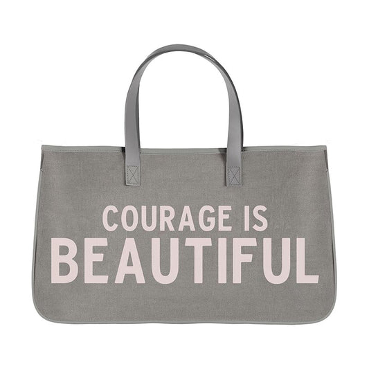 COURAGE IS BEAUTIFUL Canvas Tote - Grey with Blush Text - Canvas with PU Lining and Leather Accents - Size: 20"W x 11"H x 6"D - Pocket: 9"W x 7.5"H - Shop Blue Orchid Boutique